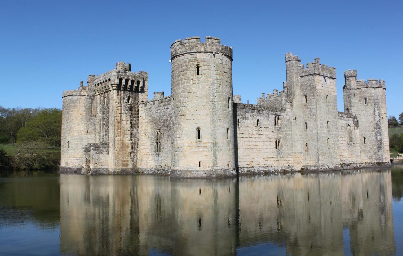 Scenic view of medieval Bodiam Castle surrounded by a moat in England.