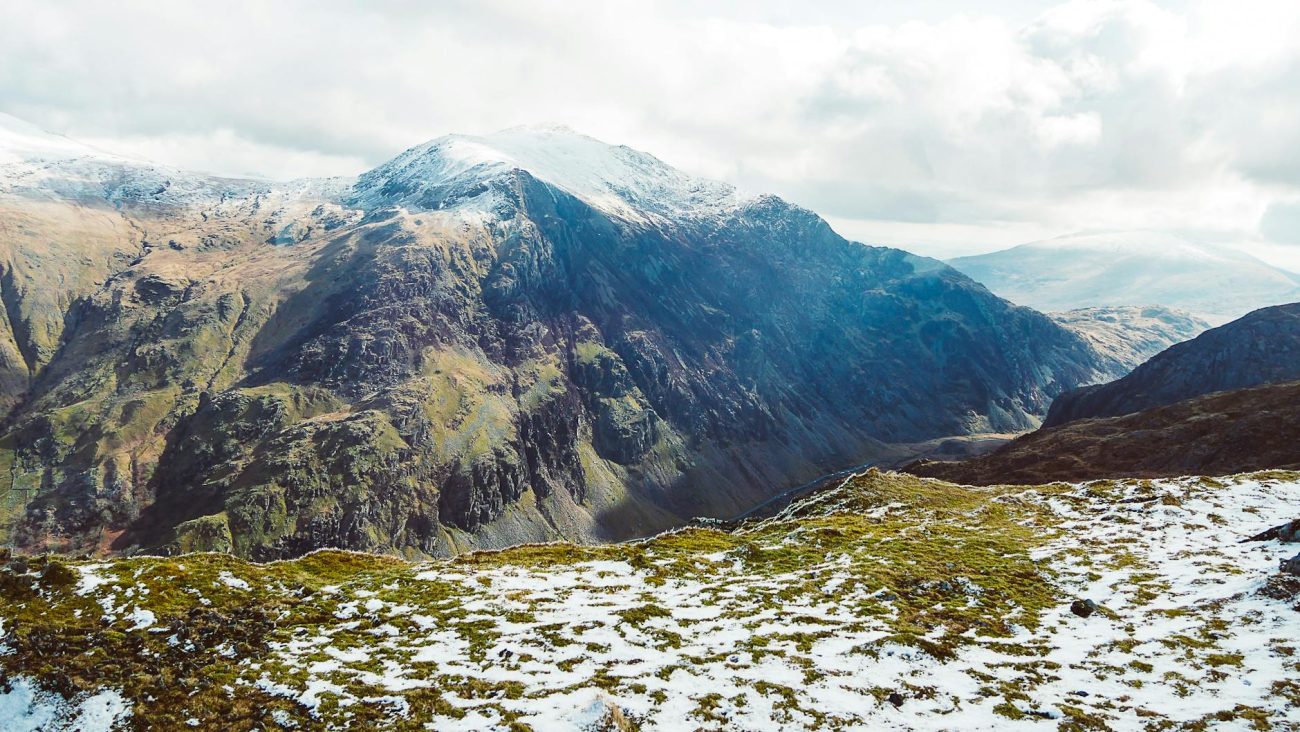 Explore the breathtaking snow-capped peaks of Snowdonia, offering an awe-inspiring view of Wales' natural beauty.