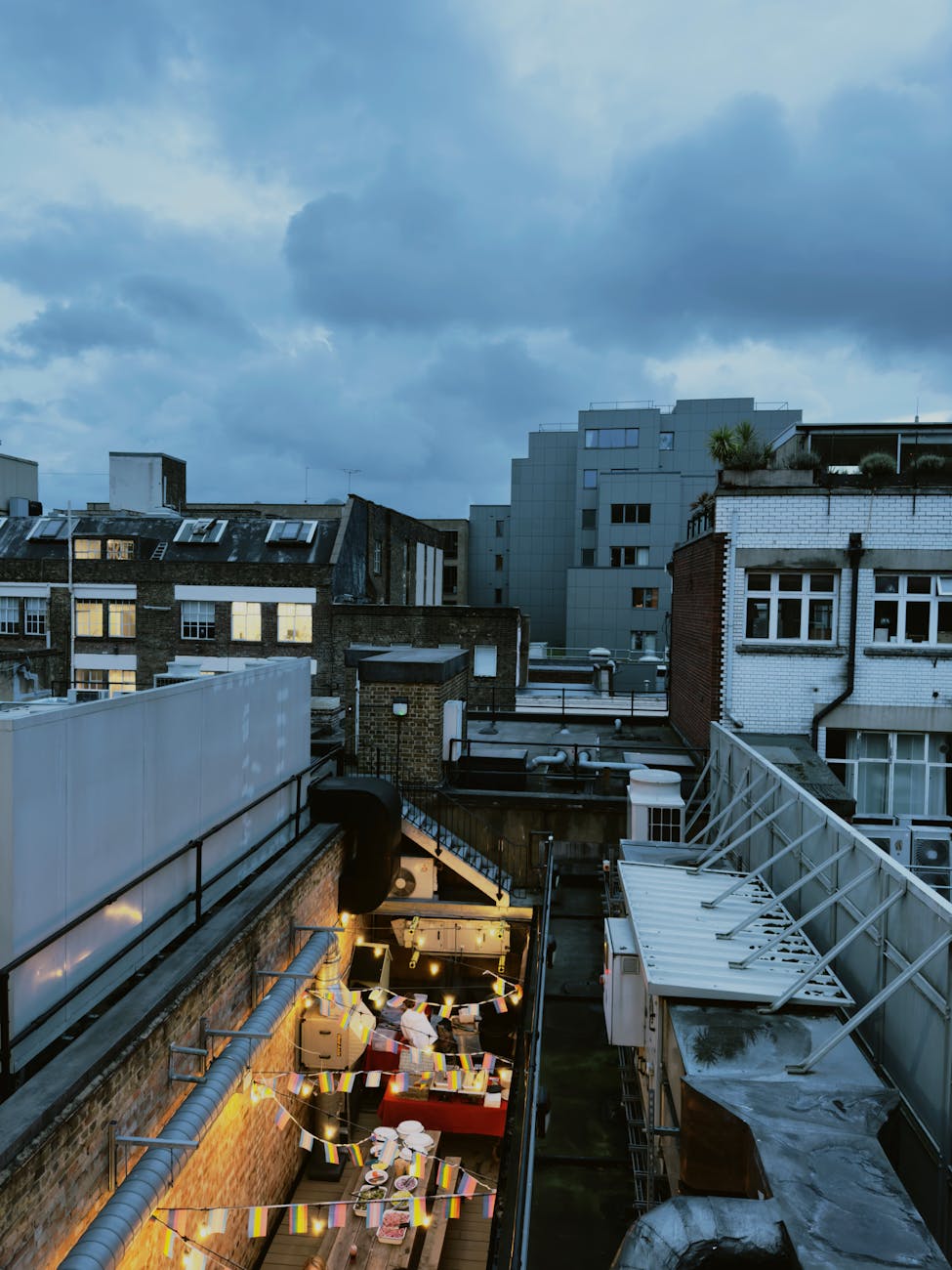 Stunning evening rooftop scene showcasing the lively atmosphere of London after dark.